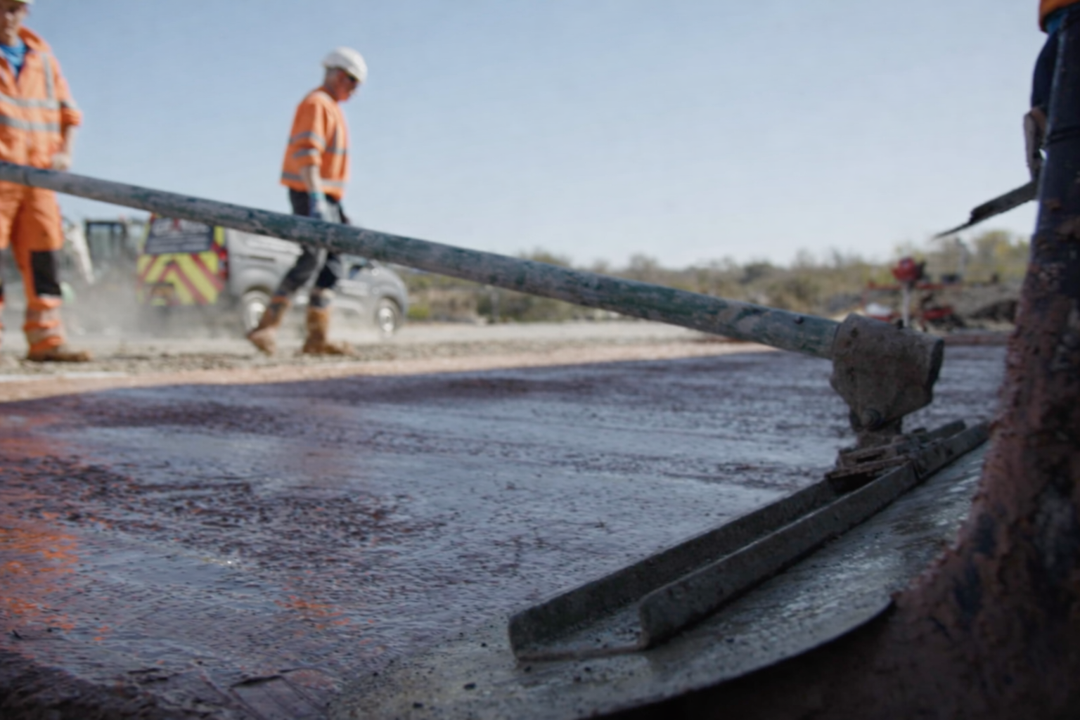 Smoothing red concrete on site